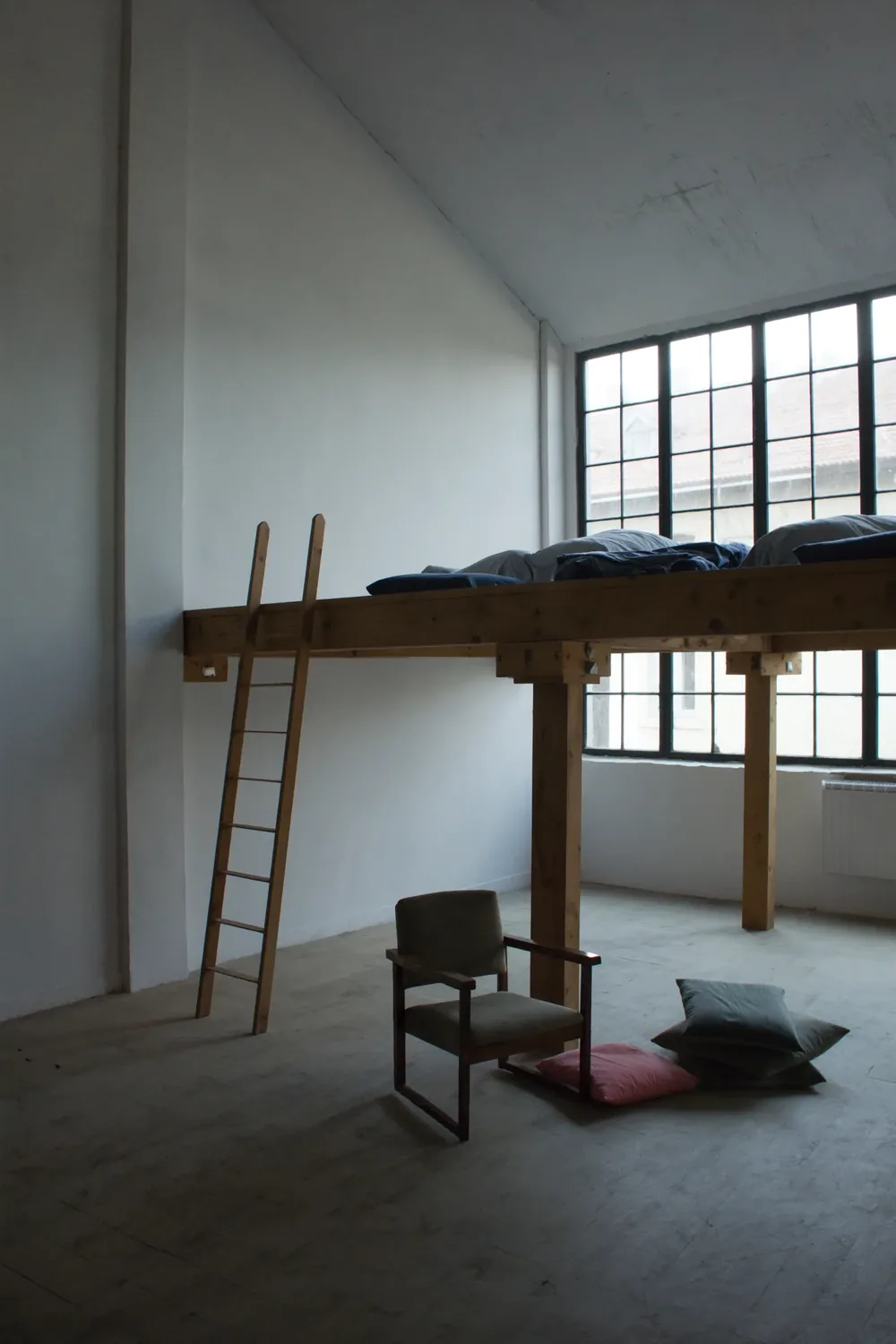 An Atelier: double height, the original bank of windows.